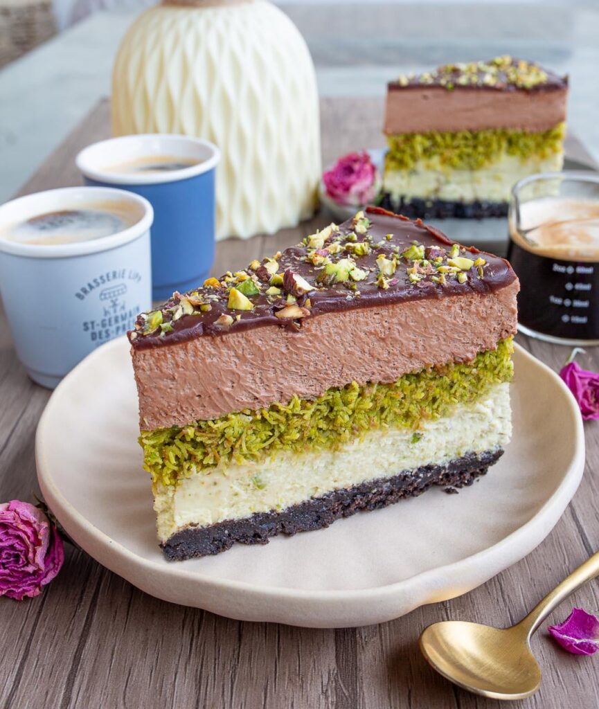 [Pro/Chef] Dubai Cheesecake. Oreo crust, baked pistachio cheesecake, chocolate cheesecake mousse, chocolate ganache, crunchy pistachio layer with kataifi dough.