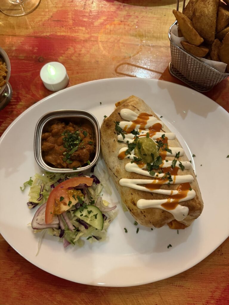 How many cals? A chicken burrito on a 12 inch tortilla ( has cheese and rice inside & sour cream on the top)