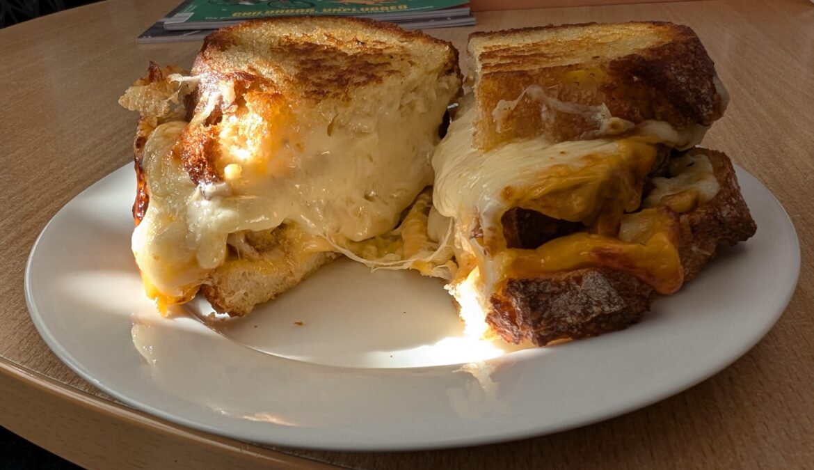 American cheddar, mozzarella and Swiss cheese  + bonus bread slice in the middle. Dipped in tomato soup. Have died, am posting from heaven.