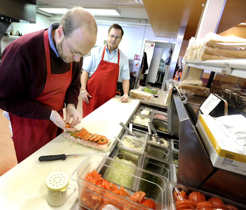Maine at Work: Reporter discovers Amato’s secret ingredient: A flowchart Steve Shea, right, director of operations for Amato's in Freeport, guides Ray Routhier.