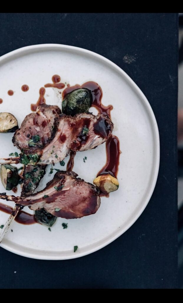 Cocoa roasted lamb, cherry Tempranillo jus, baby patty pan squash sautéed in foie gras, gremolota.