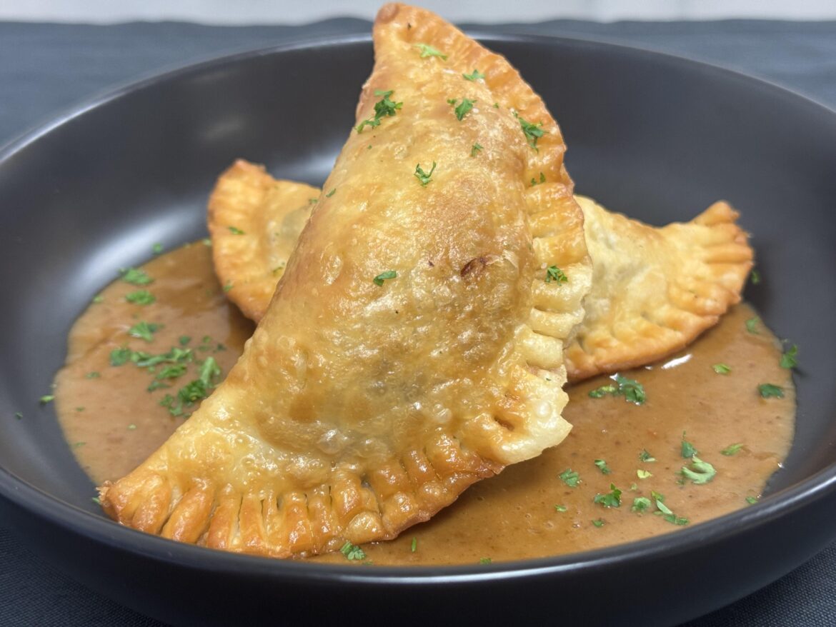 Short rib and mashed potato empanadas with buttered out braising liquid