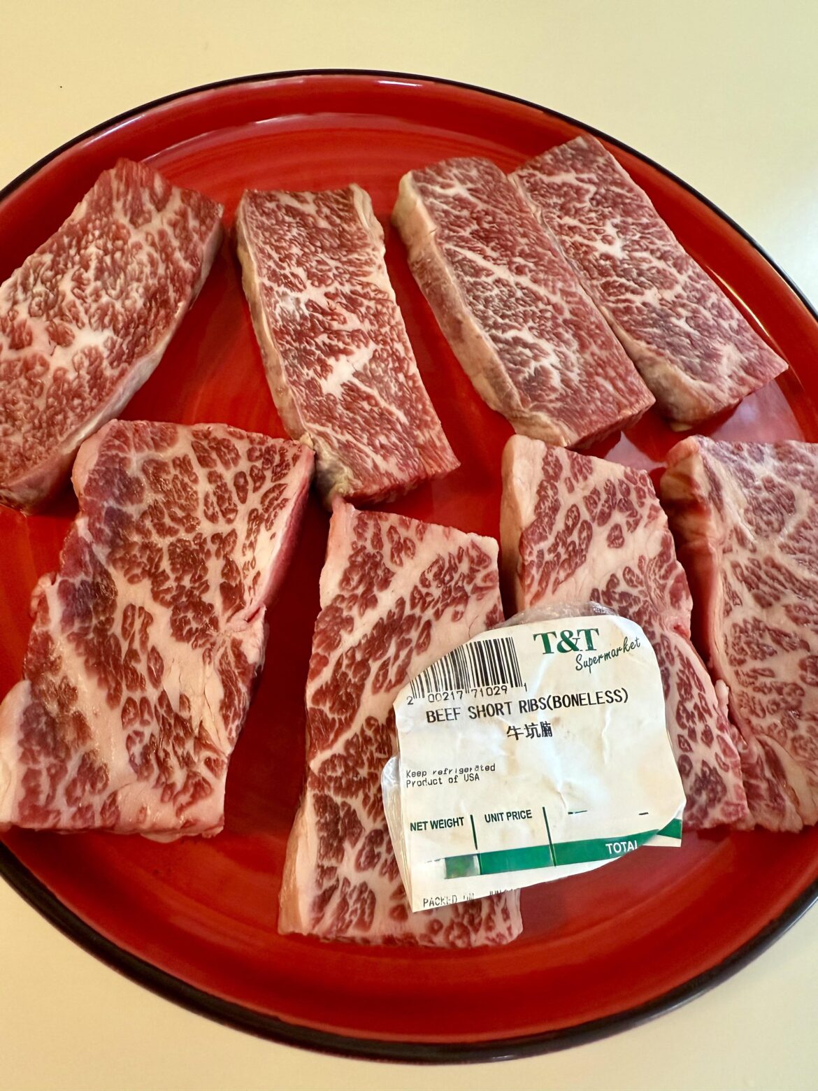 Boneless beef short ribs. Wondering if I should sear on a hot cast-iron flattop or grill. Any input appreciated.