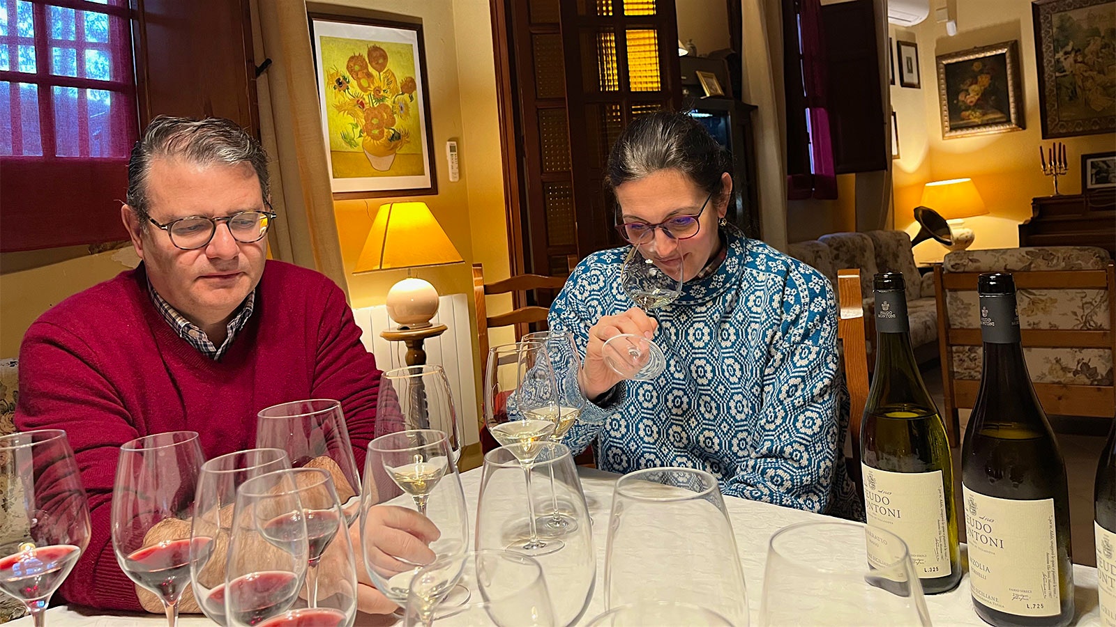  Fabio Sireci and Melissa Muller tasting wines around the dining table in their home