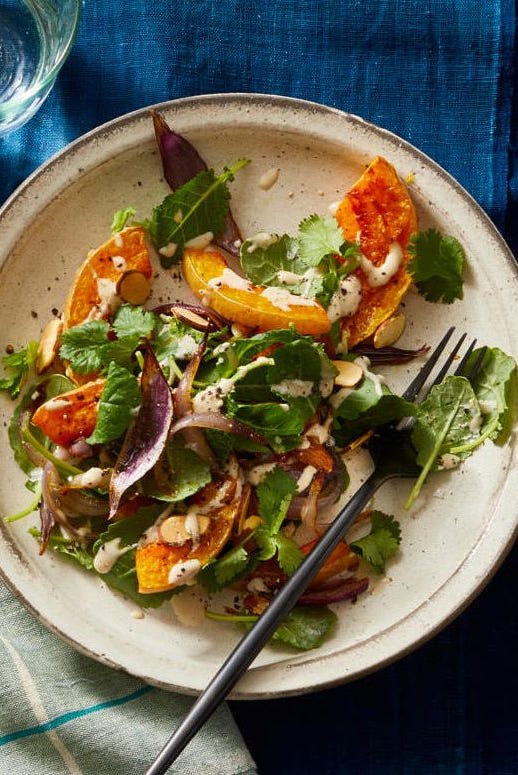 roasted butternut squash salad with tahini vinaigrette on a plate