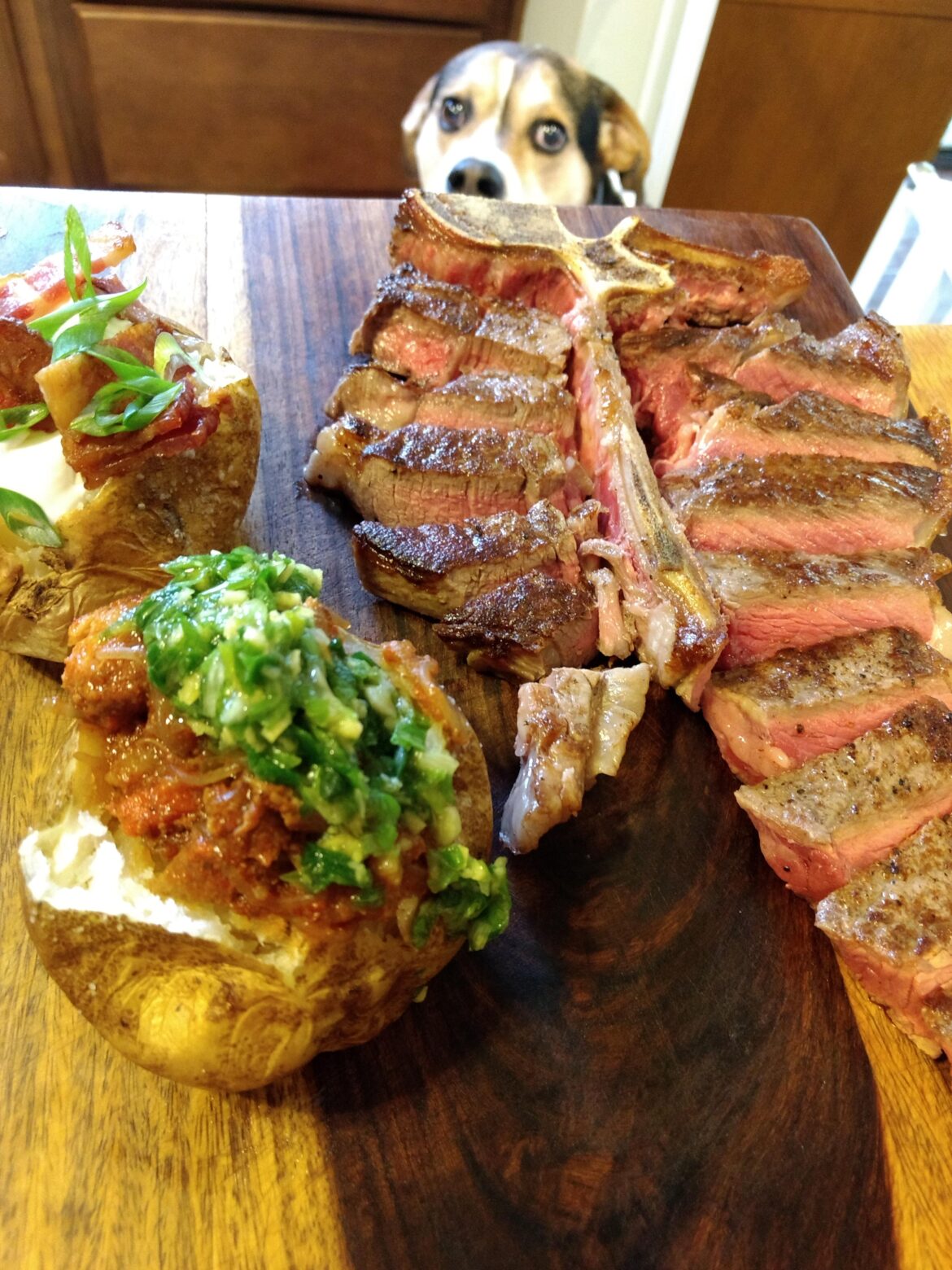 T-bone and baked potatoes