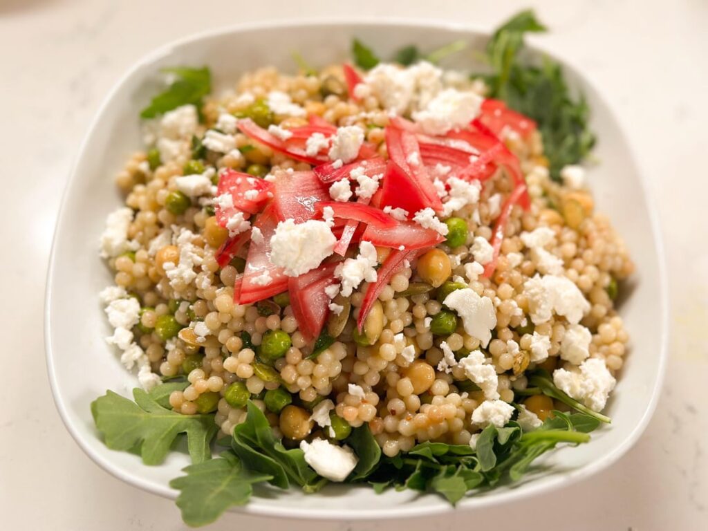 Pearl Couscous with Lemon, Mint, Peas, Feta, and Pickled Shallots By Erin McMurrer from Cook’s Illustrated, July/August 2025