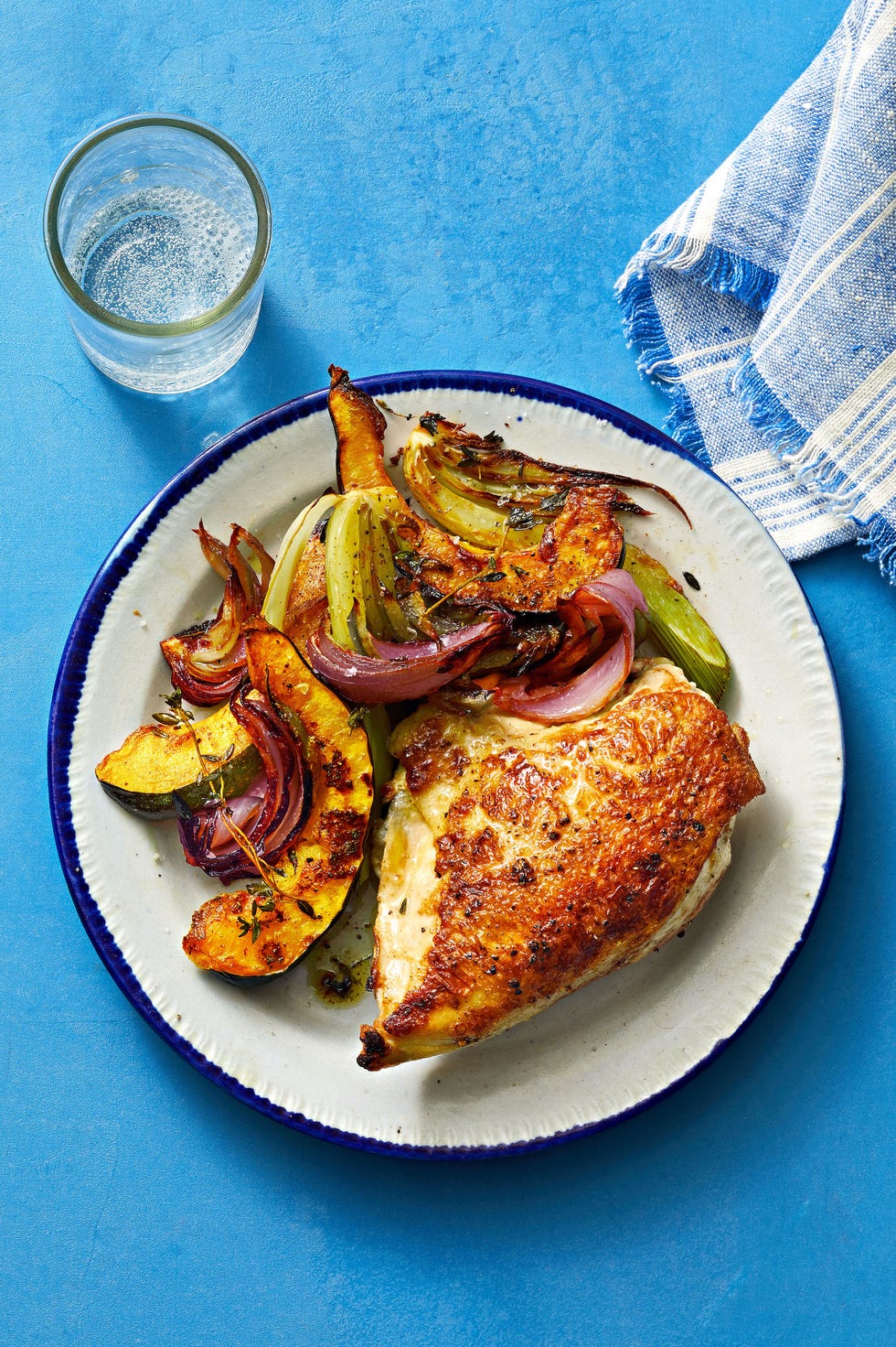 roasted chicken and vegetables on the side