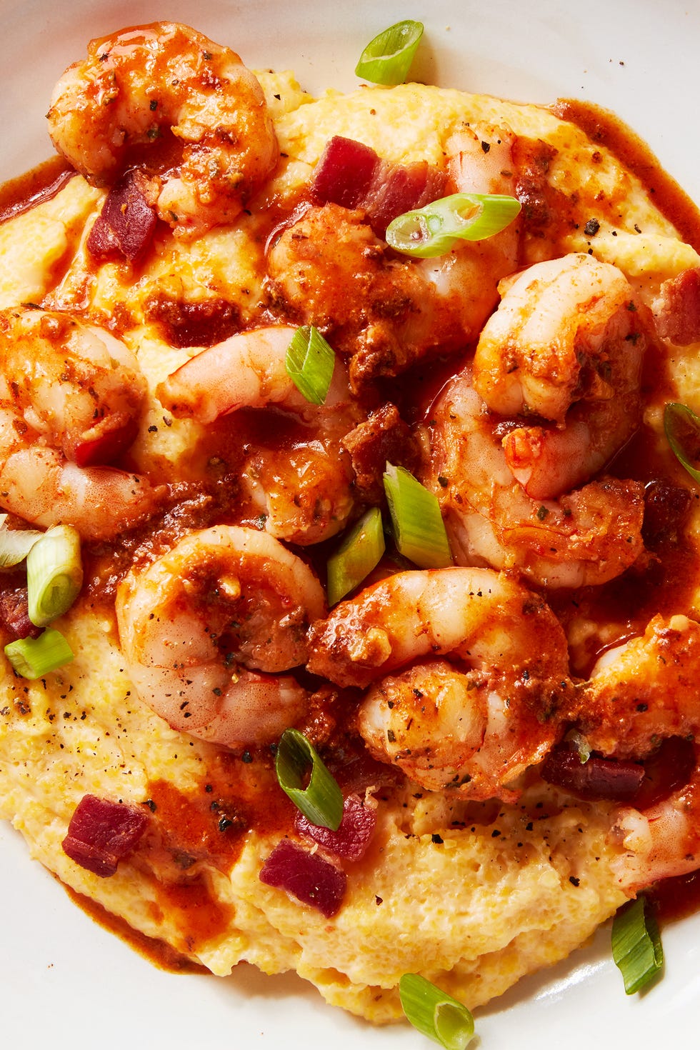 shrimp and grits in a bowl with greens onion