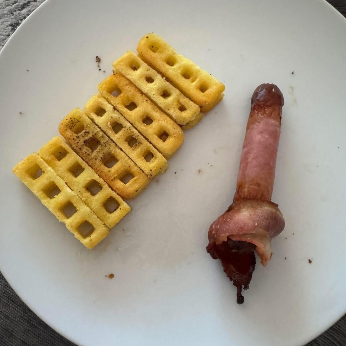 Behold my waffle fries and a bacon wrapped sausage so it is!!