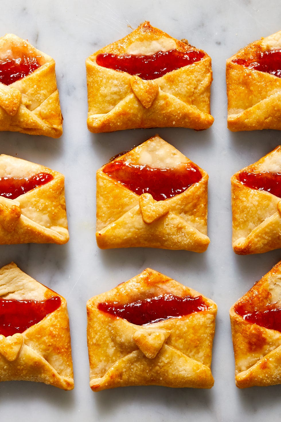 strawberry jam filled cookies that are folded and baked to look like love notes