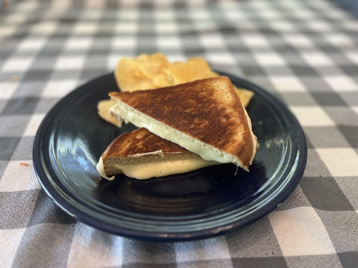 Whole grain white bread with cooper sharp and havarti cheese. Side of hot honey potato chips.