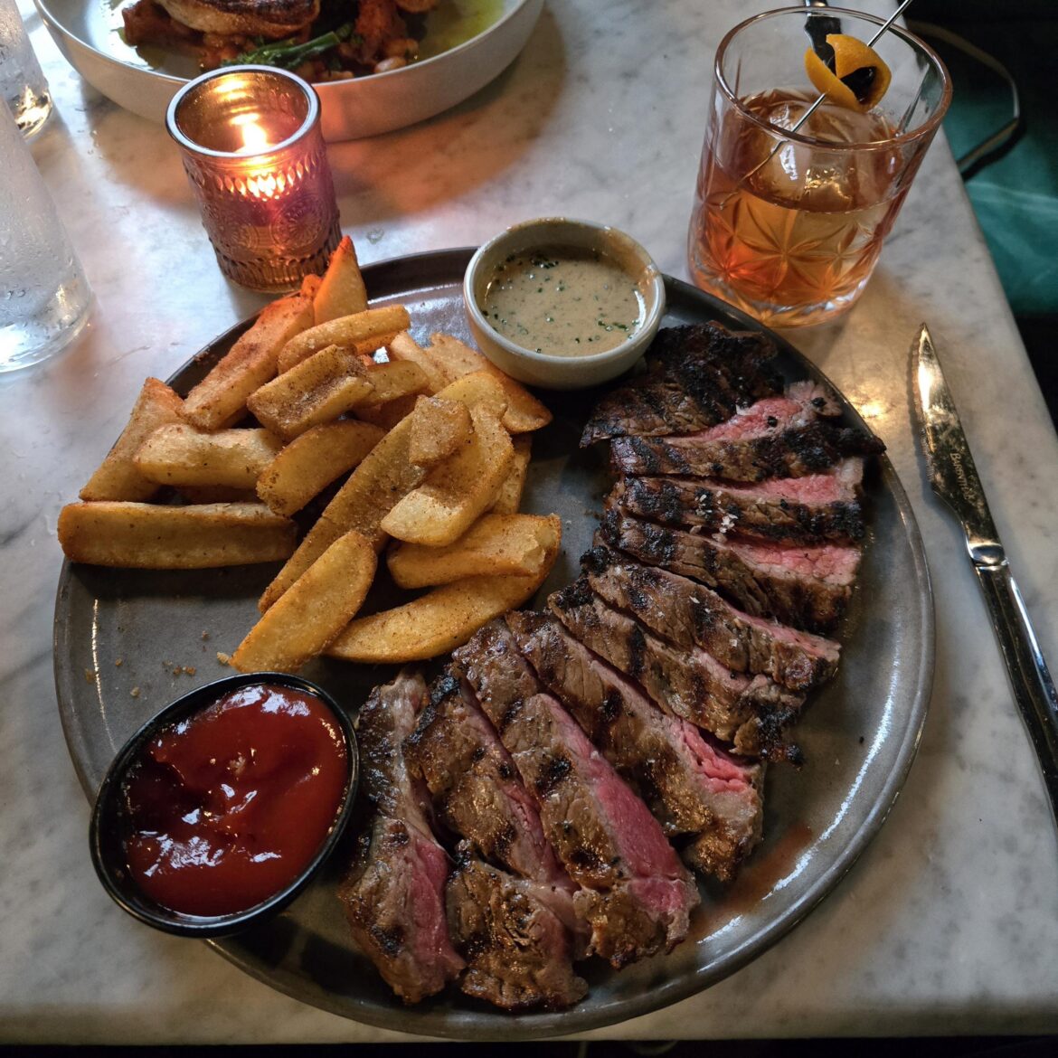 [I ate] New York strip steak frites with au poivre and ketchup