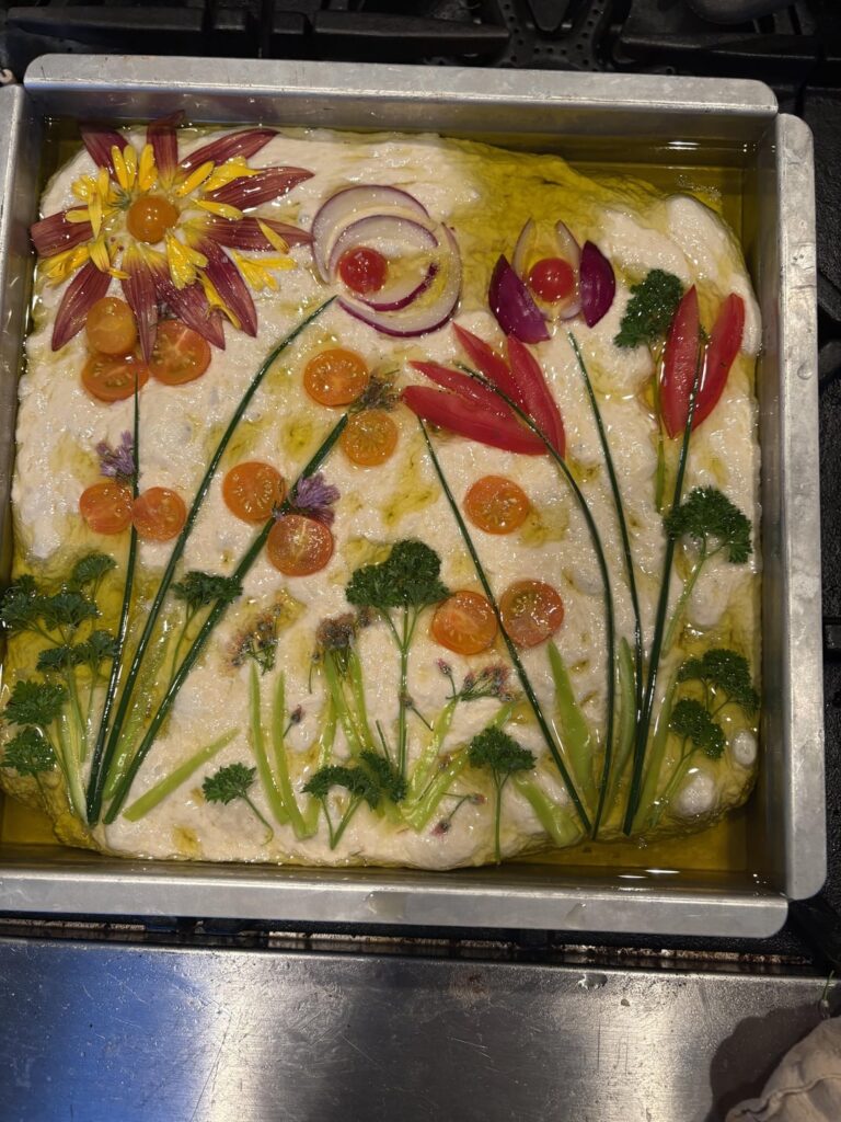 Kinda proud of this focaccia I made with sungold petals.