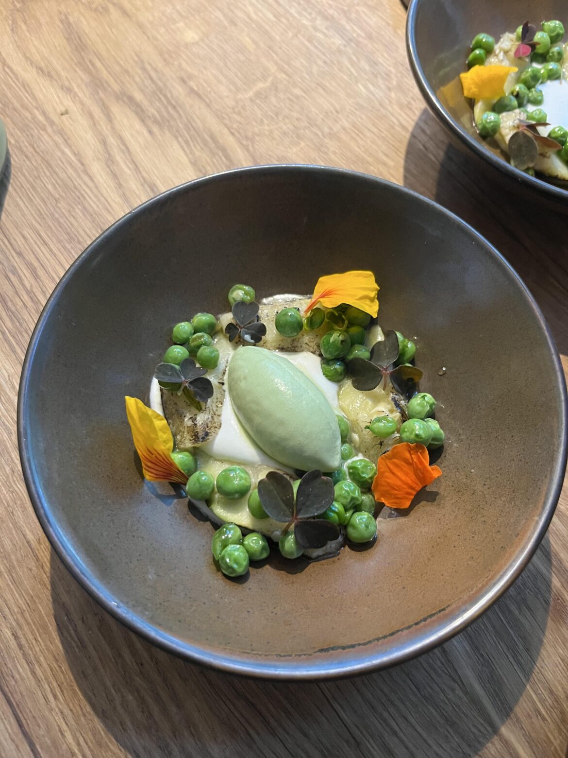 Wood sorrel ice cream, chevre creme, grilled peas and zucchini
