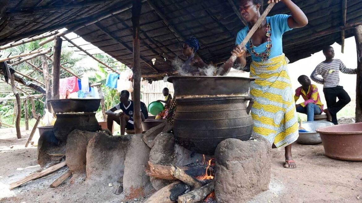 Cooking attieke over wood in Ivory Coast