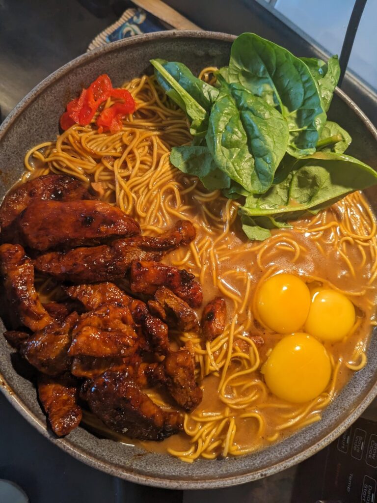 [homemade] ramen with pork spinach and raw egg yolks