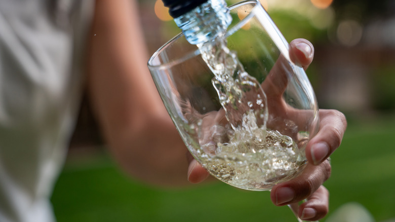 White wine being poured into wine glass