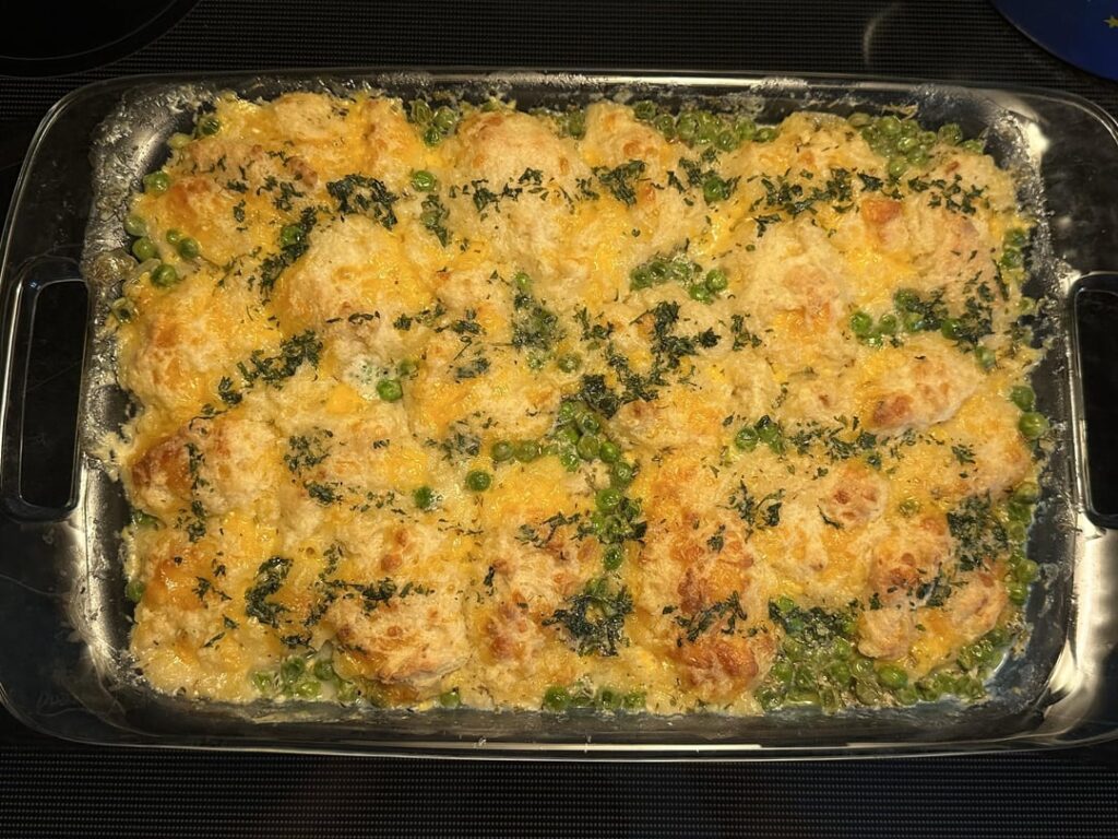 Chicken pot pie bake with a cheddar biscuit top