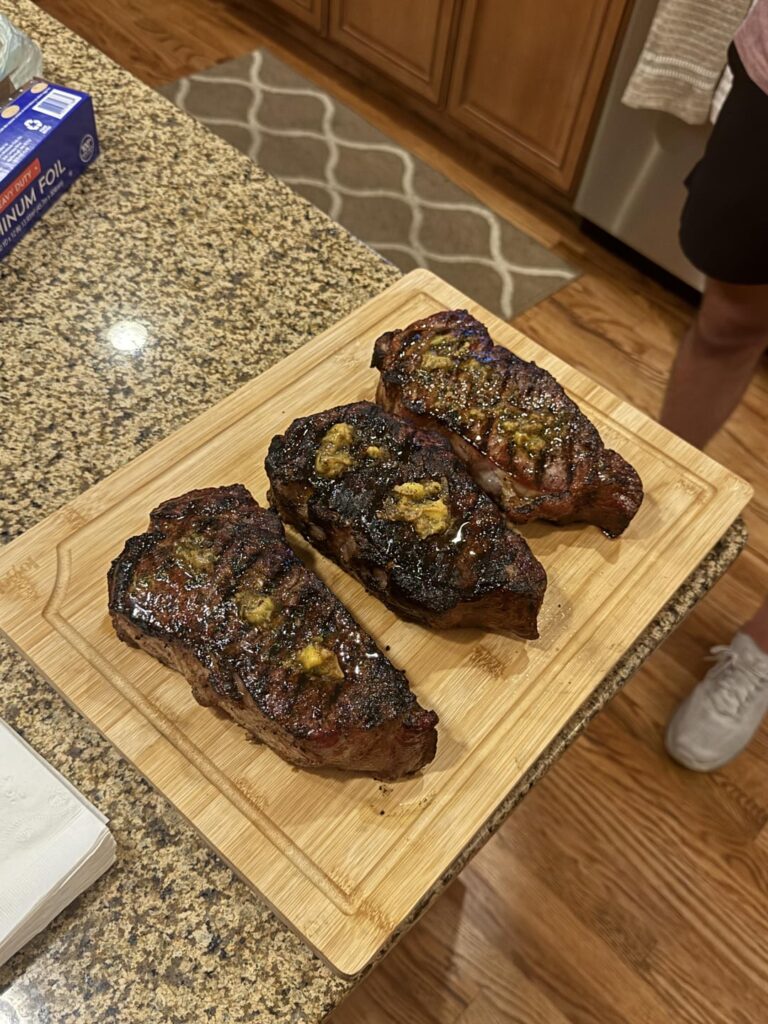 [homemade] three new york strip steaks with cowboy butter
