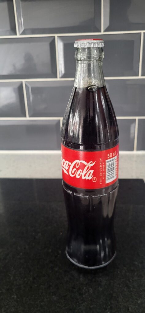 Glass bottle of coke (less sugar) Nigerian