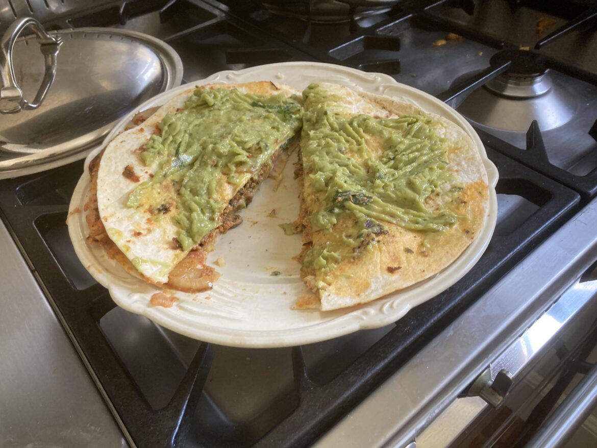 Executed in France-Quesadilla with chorizo, eggs and guacamole