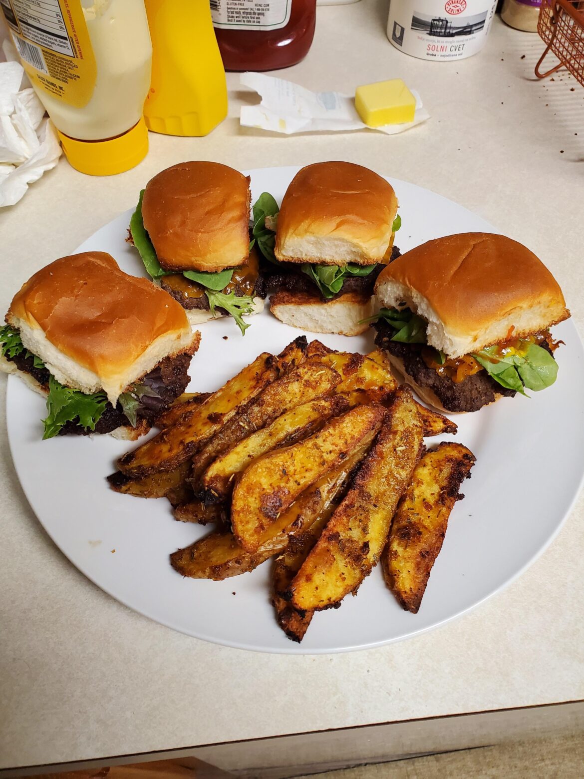 Butter basted sliders on Hawaiian rolls with cajun ranch potato wedges