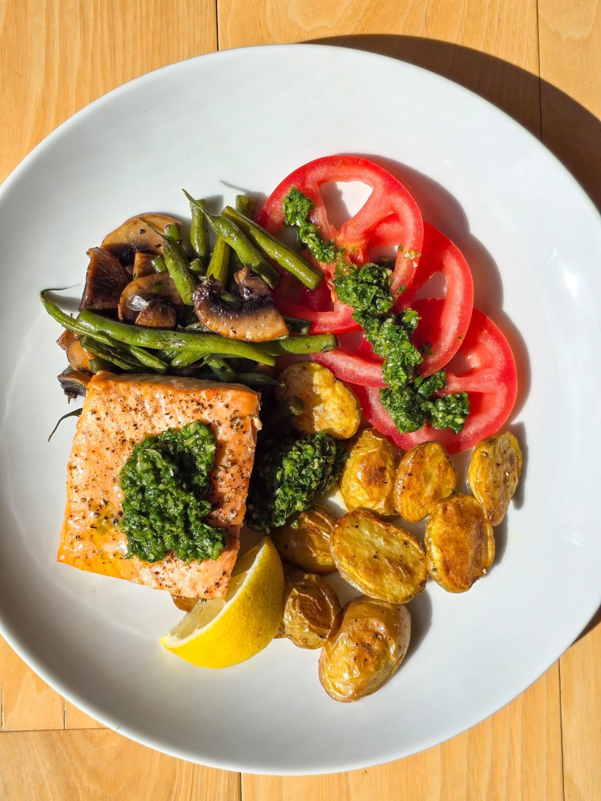 Grilled salmon, zhug sauce, roasted potatoes, green beans and mushrooms