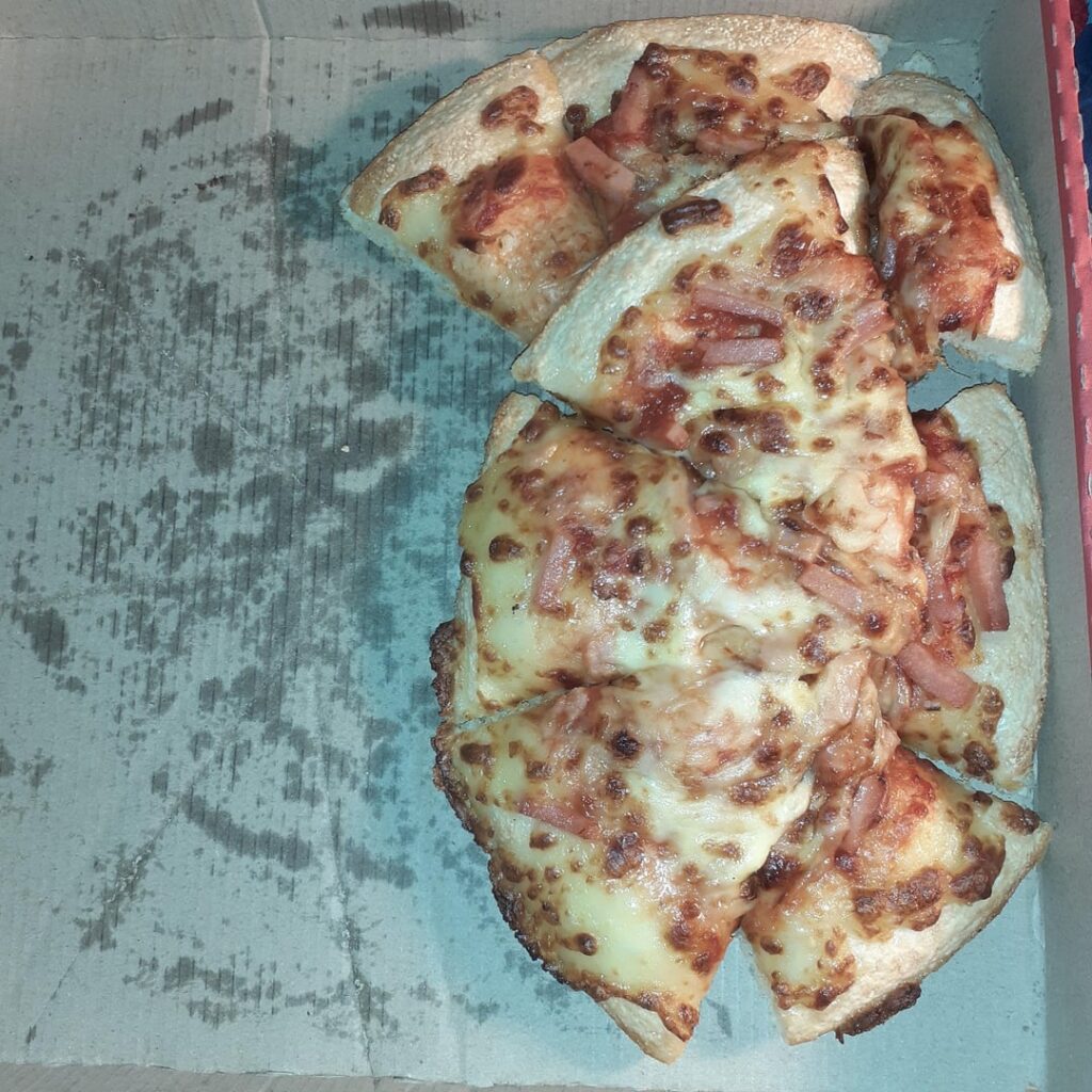 Mom turned the pizza sideways, but I was able to somewhat fix it.
