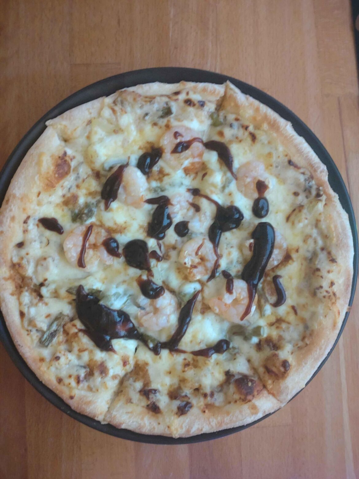 My friends pizza today. With fine ragout, shrimps, pineapple, asparagus, cheese and bbq sauce as a topping.
