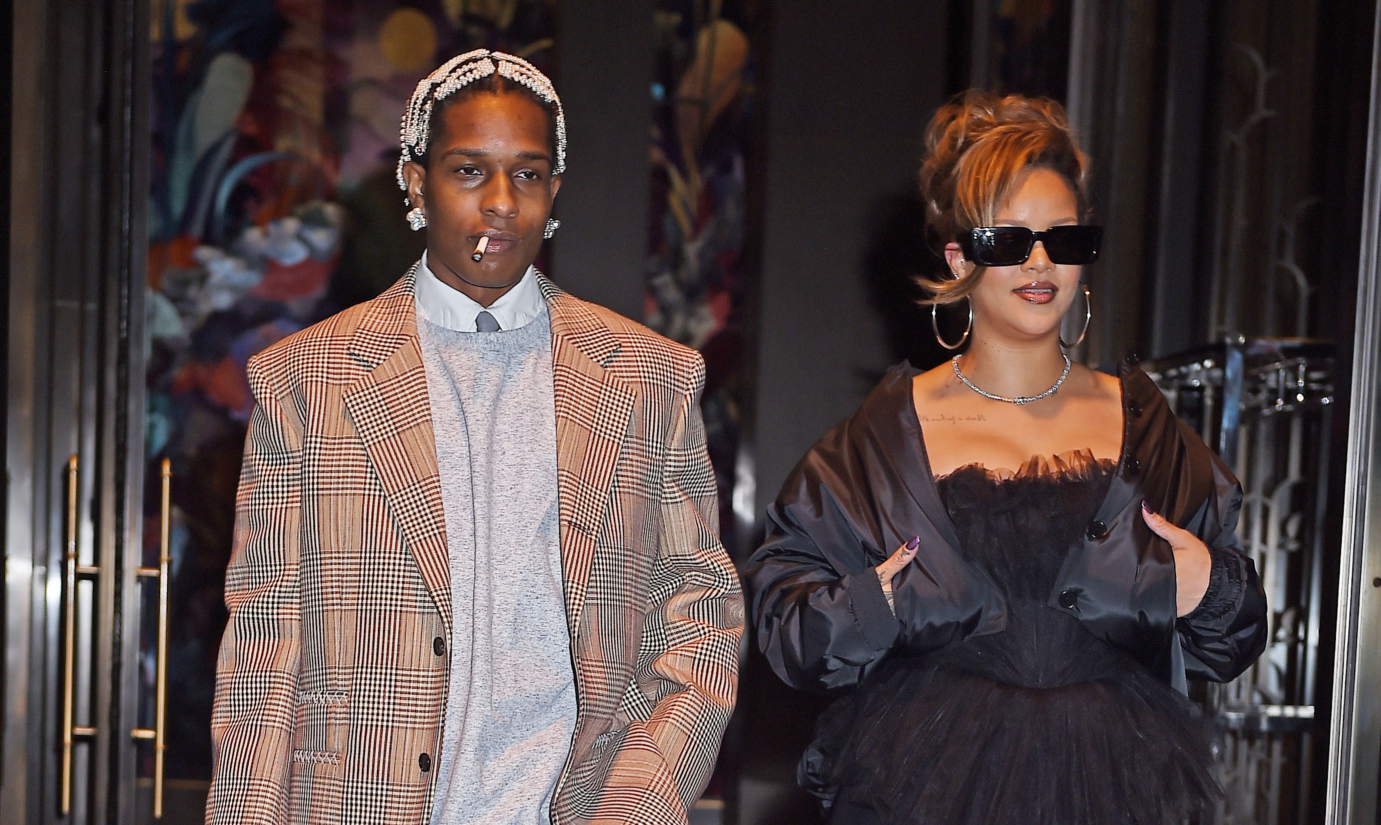 ASAP Rocky and Rihanna leaving a restaurant.