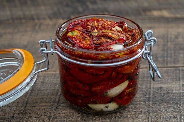 Sun-dried red tomatoes with garlic, olive oil