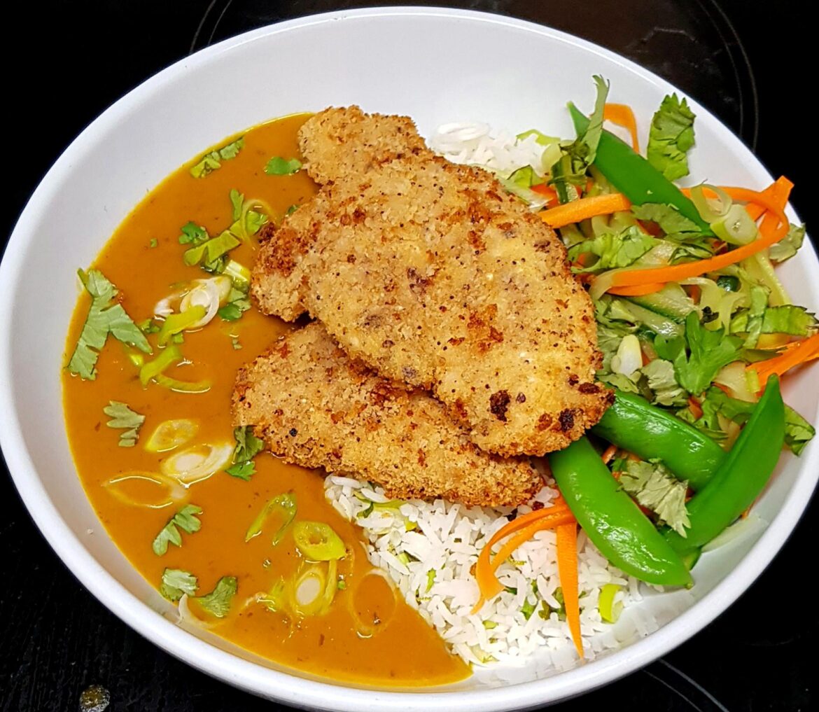 Homemade Spin on Katsu Curry with Breaded Chichen, Lime Coriander Rice and Lightly Pickled Vegetables.