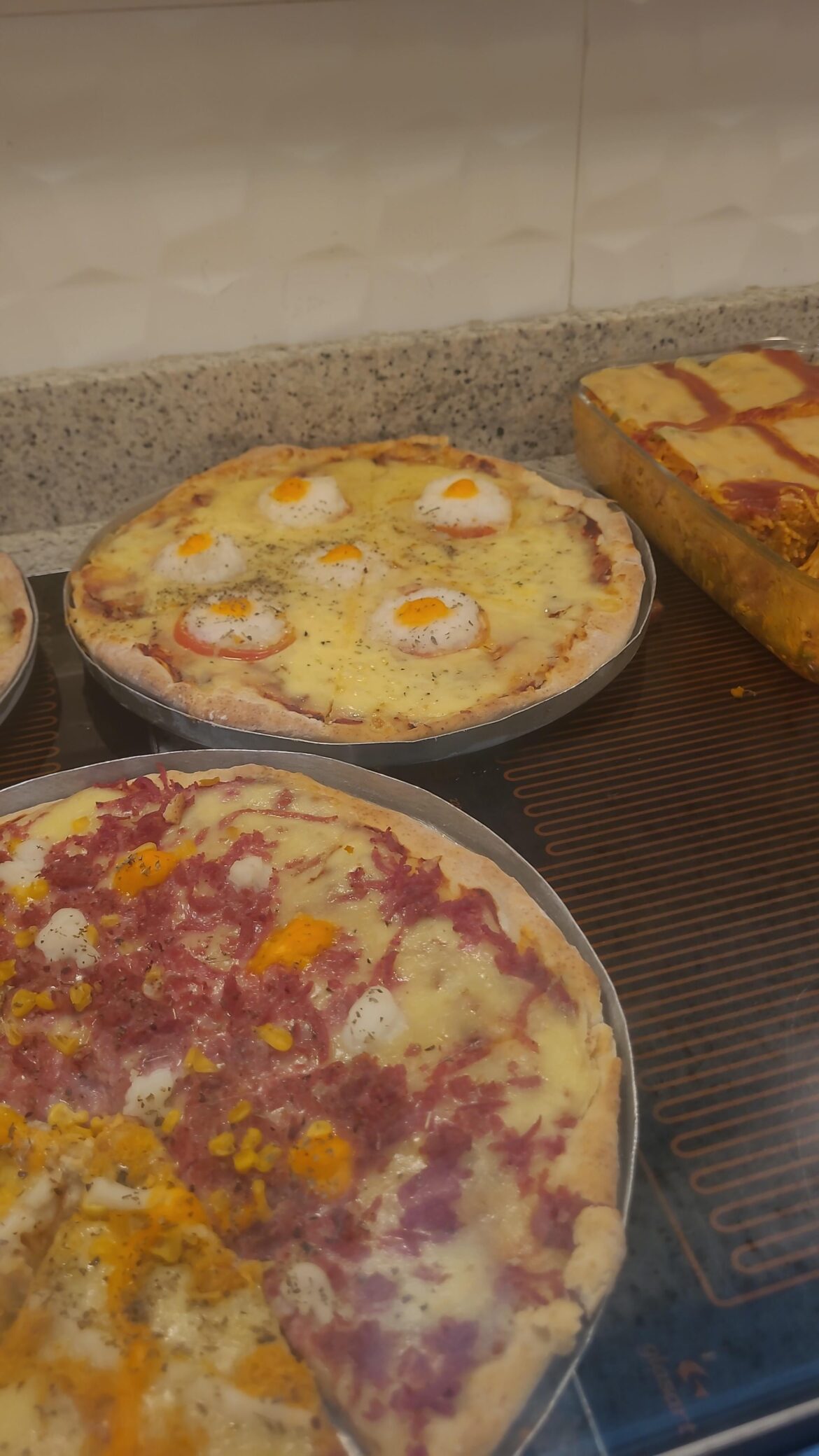 I went to a buffet in a supermarket for dinner and saw this atrocity. An egg pizza.