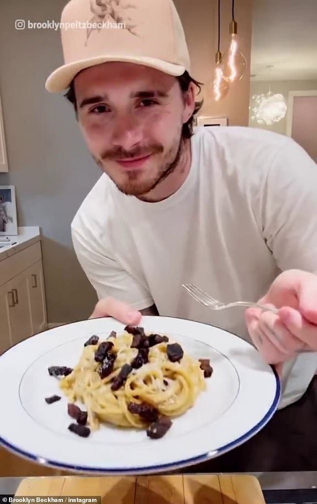 Amid their feud Brooklyn appeared to miss out on more family memories as he remained in Los Angeles with his wife Nicola Peltz (pictured making pasta in a past Instagram video)