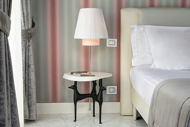 The rooms are bright and airy, decorated with draped curtains