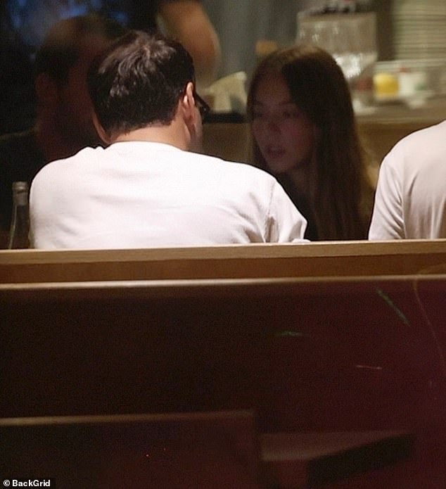 It seemed as if they had friends with them as there was a man next to Braun