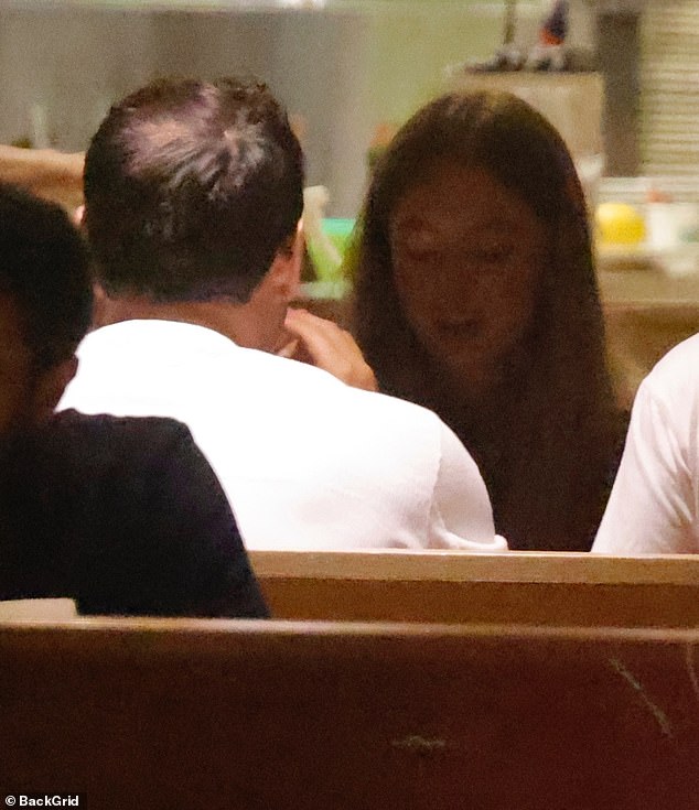 While at their dinner, Sweeney wore her blonde hair down as she had on a dark top, shorts that highlighted her toned legs, and calf-height boots