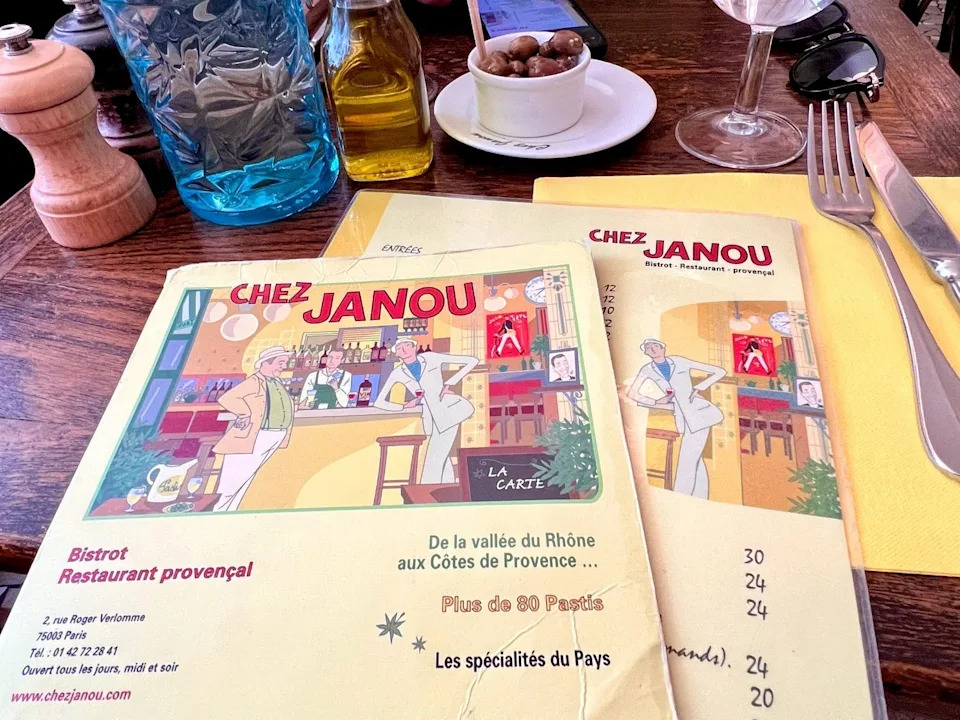 Menus and the complimentary olive dish at Chez Janou