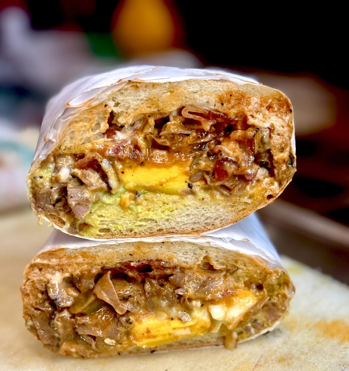 Roast Beef, Fried Egg, Bacon, Avocado, with Cheddar and American Cheese sandwich