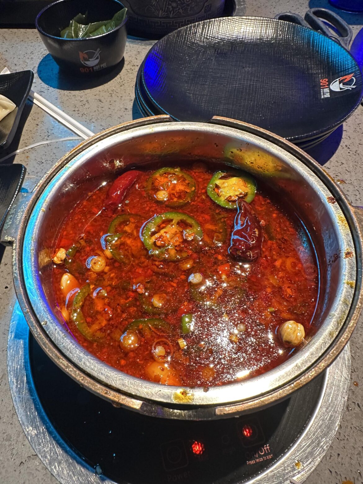 Wife and I went decided to get hot pot for dinner last night. I started with the Szechuan soup base, then proceeded to add every single hot pepper, seasoning, sauce and oil they had. Here’s the result before digging in.