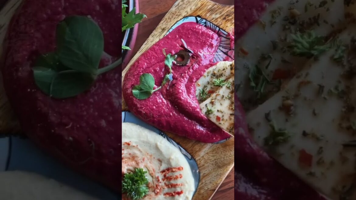 Dip into perfection – creamy hummus, warm pita & colorful toppings waiting for you