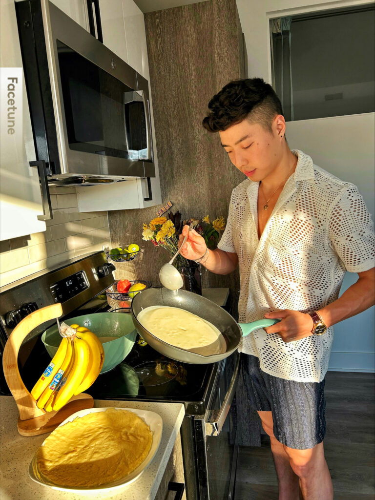 Joubert ladling batter into a frying pan