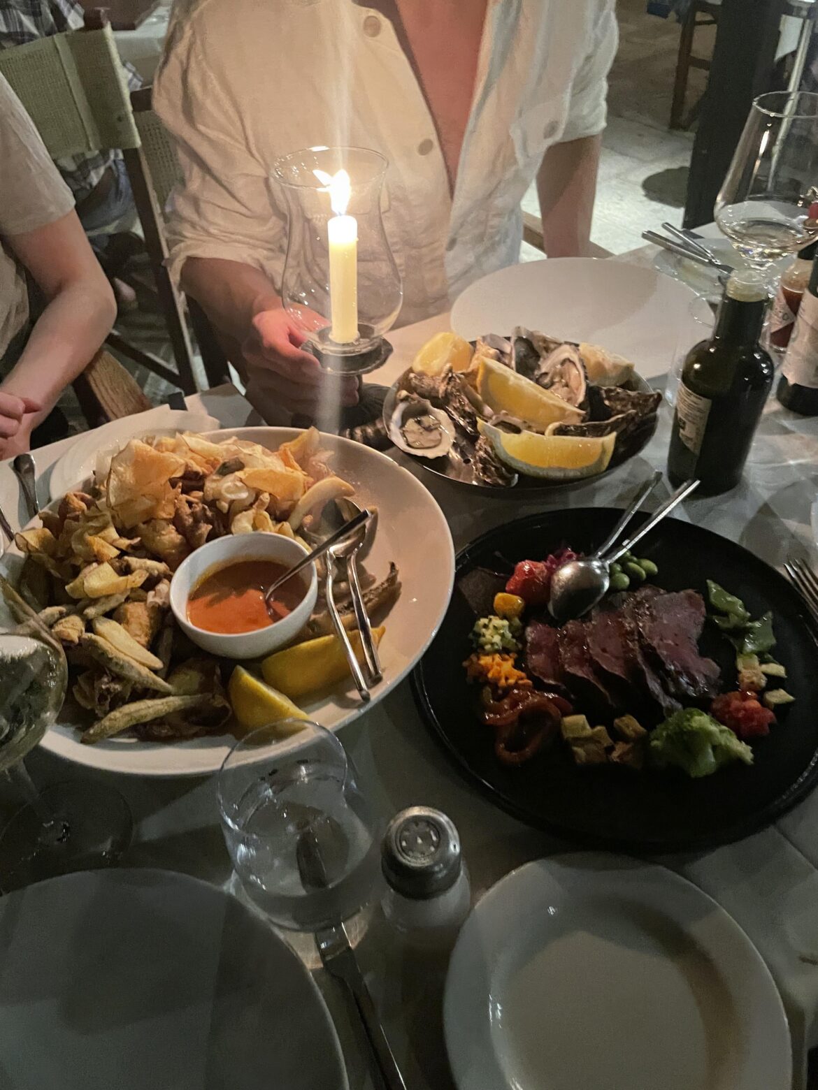 Oysters, fried fish, and beef carpaccio in Sardinia
