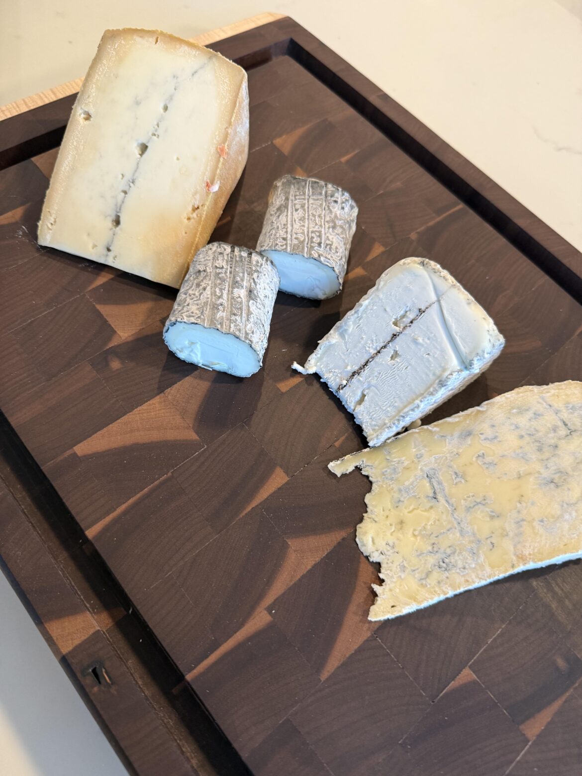 Was given 2 known and 2 unknown cheeses, any ideas?