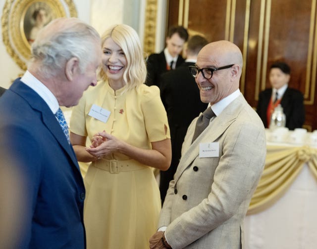 The King meets the then-Prince’s Trust celebrity ambassadors, Stanley Tucci and Holly Willoughby at Buckingham Palace