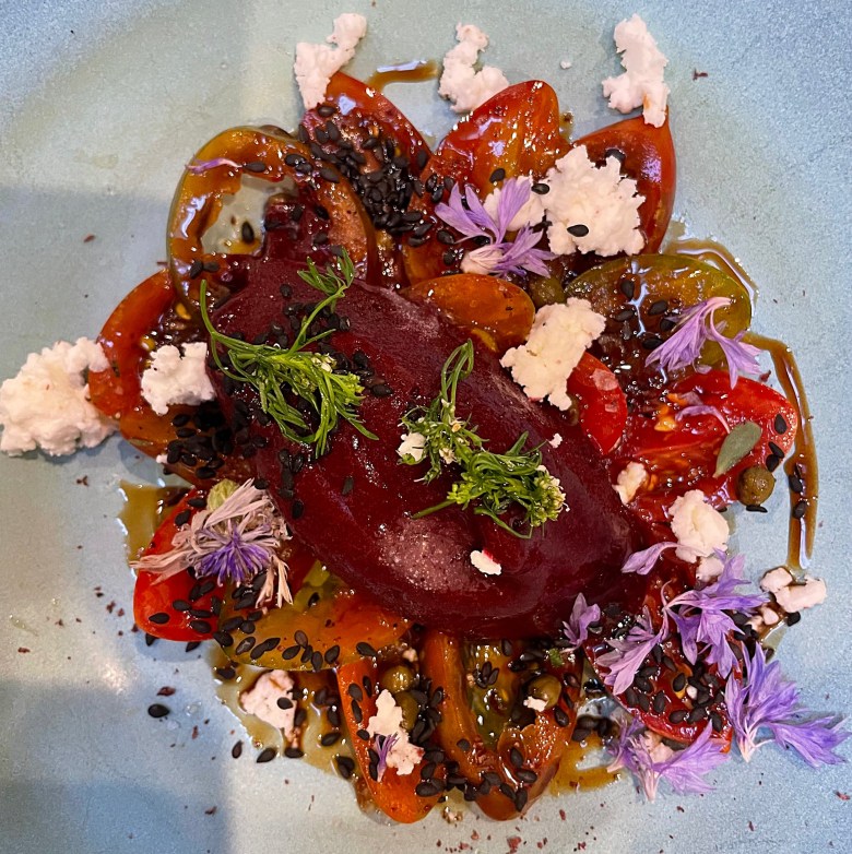 Carpaccio of tomatoes with raspberry sorbet and feta cheese.