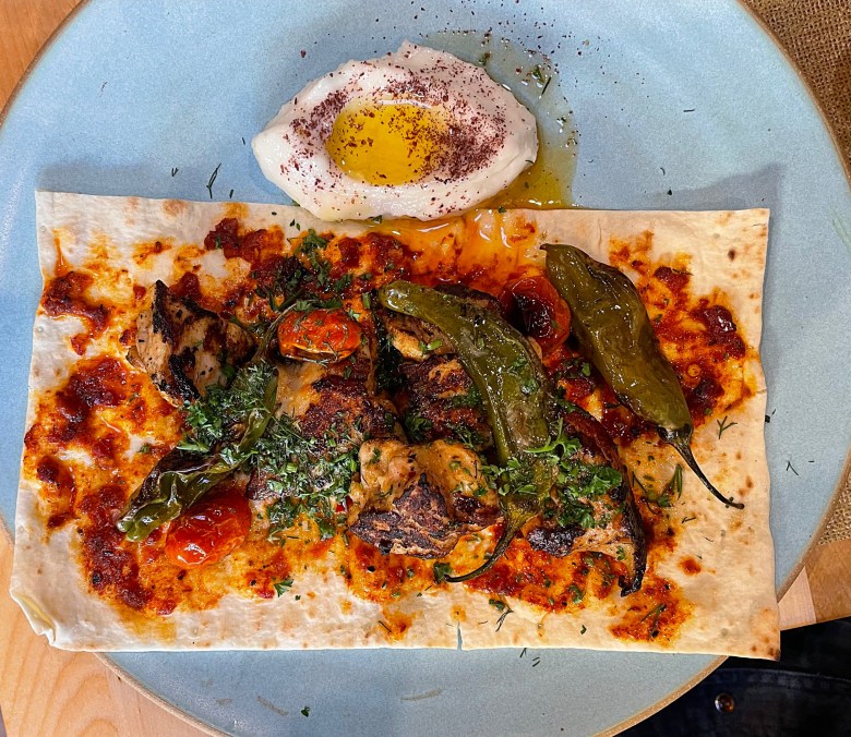 Aegean raises the color bar with its Tavuk Kebab with harissa and yogurt-marinated chicken thighs,lavash garlic toum sauce and blistered peppers and tomatoes.