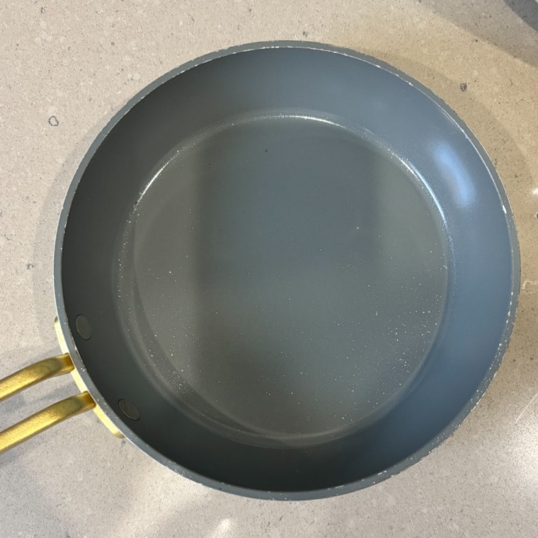 A GreenPan skillet on a kitchen counter.