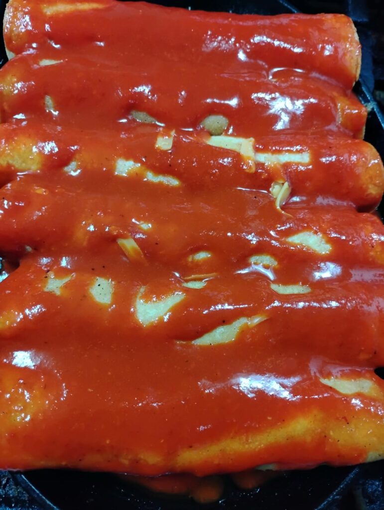 Smothered rolled tacos